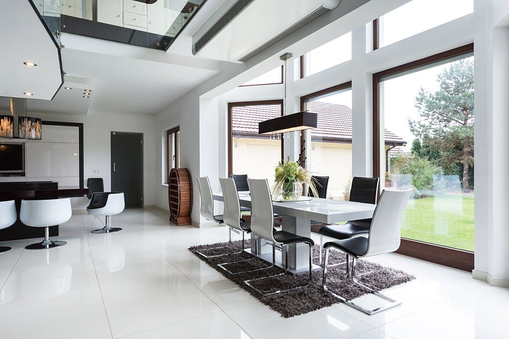 The bright dining room connected to the kitchen in the residence